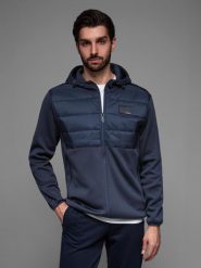 Lekka kurtka męska z łączonych materiałów z kapturem i ozdobnym pikowaniem – granatowa V4 OM-JANP-0160 - XXL. Niebieskie kurtki męskie Ombre Clothing, l, z aplikacjami, z gumy, z kapturem. W wyprzedaży za 139.99 zł.