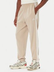 Adidas Spodnie dresowe Essentials 3-Stripes French Terry Tapered Cuffed KY4196 Beżowy Regular Fit. Brązowe spodnie sportowe męskie Adidas, l, bez wzorów, z bawełny. Za 219.99 zł.