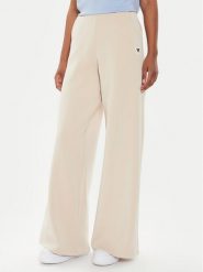 Guess Spodnie dresowe V4YB07 KCAY2 Beżowy Relaxed Fit. Brązowe spodnie dresowe damskie Guess, z aplikacjami, z dresówki. Za 269.99 zł.