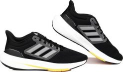 Adidas Buty męskie do biegania adidas Ultrabounce czarno-szare HP5777 43 1/3. Czarne buty sportowe męskie Adidas, bez wzorów, bez zapięcia, do biegania. Za 352.81 zł.