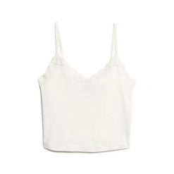 Krótki top z koronkowymi wykończeniami dla kobiet Superdry Athletic Essentials. Białe topy damskie Superdry, l, bez wzorów, z koronki, eleganckie, bez kołnierzyka, bez ramiączek. Za 104.45 zł.