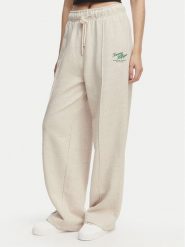 Tommy Hilfiger Spodnie dresowe Logo Exaggerated Seam WW0WW50783 Kremowy Relaxed Fit. Białe spodnie dresowe damskie Tommy Hilfiger, bez wzorów, z bawełny. Za 649.99 zł.