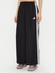 Adidas Spodnie dresowe Essentials 3-Stripes JE1306 Czarny Loose Fit. Czarne spodnie dresowe damskie Adidas, bez wzorów, z dresówki. Za 159.99 zł.