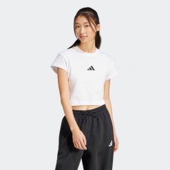 Koszulka damska ADIDAS. Bluzki damskie Adidas, m, bez wzorów, z bawełny, bez kołnierzyka, bez ramiączek. Za 99.99 zł.