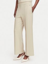 Calvin Klein Spodnie materiałowe LV044G210G Beżowy Wide Leg. Brązowe spodnie materiałowe damskie Calvin Klein, bez wzorów, z materiału. Za 359.99 zł.