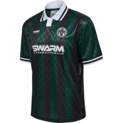 Koszulka Hummel Loose. Zielone bluzki damskie Hummel, bez wzorów, sportowe, bez kołnierzyka, bez ramiączek. W wyprzedaży za 193.50 zł.