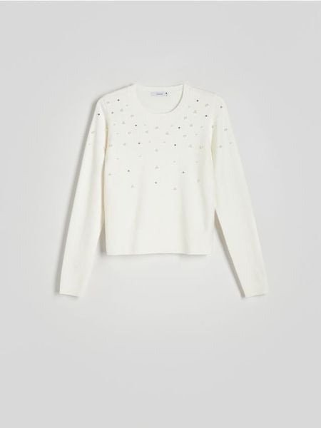 Sweter z aplikacją - kremowy. Białe swetry nierozpinane damskie Reserved, l, z aplikacjami, z dzianiny, bez kołnierzyka, bez ramiączek. W wyprzedaży za 49.99 zł.