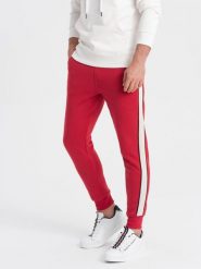 Spodnie męskie dresowe z lampasem - czerwone V4. Czerwone spodnie sportowe męskie Ombre Clothing, m, bez wzorów, z bawełny. W wyprzedaży za 39.99 zł.