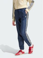 Adidas Spodnie dresowe Pinstripe Firebird Track Pant KR7037 Granatowy Regular Fit. Niebieskie spodnie dresowe damskie Adidas, bez wzorów, z dresówki. Za 399.99 zł.
