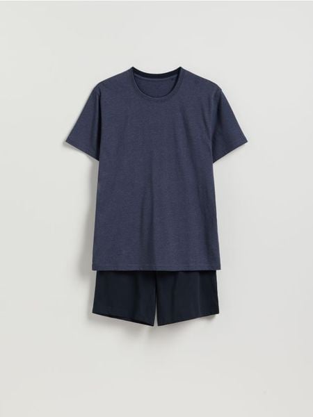 Dwuczęściowa piżama z bawełny - granatowy. Niebieskie piżamy męskie Reserved, l, bez wzorów, z bawełny, bez kołnierzyka, bez ramiączek. Za 79.99 zł.