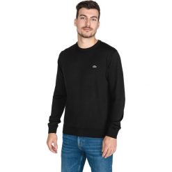 Lacoste Sweter Czarny. Czarne swetry męskie Lacoste, m, bez wzorów, z materiału, bez kołnierzyka, bez ramiączek. Za 445.95 zł.