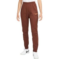 Spodnie Sportowe damskie Nike TF Academy Pant. Brązowe spodnie dresowe damskie Nike, bez wzorów, sportowe, długie. Za 247.75 zł.