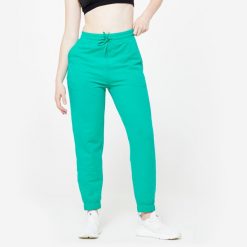 Spodnie dresowe damskie Domyos Gym & Pilates. Brązowe spodnie dresowe damskie DOMYOS, bez wzorów, z bawełny, sportowe, na fitness i siłownię. Za 89.99 zł.