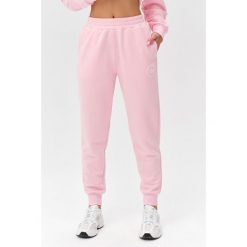 Damskie spodnie dresowe Rough Radical Cotton Active Joggers. Czerwone spodnie dresowe damskie ROUGH RADICAL, bez wzorów, z dresówki, sportowe, na fitness i siłownię. W wyprzedaży za 144.42 zł.