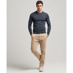 Sweter z wełny merynosów Superdry. Niebieskie swetry męskie Superdry, l, bez wzorów, z wełny, bez kołnierzyka, bez ramiączek. Za 326.40 zł.