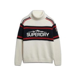 Damski sweter z golfem po nartach Superdry. Białe swetry nierozpinane damskie Superdry, na zimę, m, z aplikacjami, eleganckie, bez kołnierzyka, bez ramiączek. Za 458.30 zł.