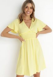 Żółta Sukienka z Wiskozy Gulpari. Żółte sukienki damskie Born2be, l, bez wzorów, z wiskozy, bez kołnierzyka, bez ramiączek, mini, rozkloszowane. Za 74.99 zł.