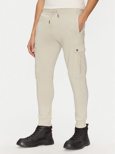 BOSS Spodnie dresowe Seteam 50542917 Beżowy Regular Fit. Brązowe spodnie sportowe męskie Boss, l, bez wzorów, z bawełny. Za 579.99 zł.