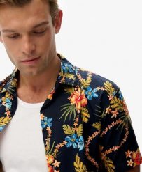 Superdry Koszula Hawaiian z nadrukiem, bawełna-modal. Niebieskie koszule damskie Superdry, m, bez wzorów, z bawełny, klasyczne, bez kołnierzyka, bez ramiączek. Za 279.65 zł.