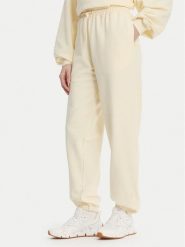 Reebok Spodnie dresowe RK25529CCW Żółty Regular Fit. Żółte spodnie sportowe damskie Reebok, bez wzorów, z bawełny. Za 199.99 zł.
