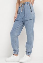 Niebieskie Jeansy o Fasonie Joggerów z Gumką w Pasie Notofa. Niebieskie jeansy damskie Born2be, bez wzorów, z gumy, eleganckie. Za 119.99 zł.