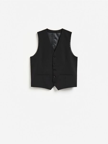 Garniturowa kamizelka - czarny. Czarne garnitury męskie Reserved, l, bez wzorów, z tkaniny. Za 159.99 zł.