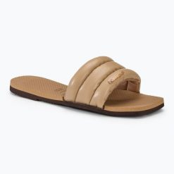 Klapki damskie Havaianas You Milan. Brązowe klapki damskie Havaianas, na lato, bez wzorów, z materiału, eleganckie, bez obcasa, bez zapięcia. Za 119.99 zł.
