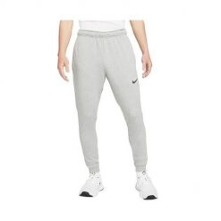 Spodnie sportowe męskie Nike Drifit Trapered. Szare spodnie sportowe męskie Nike, m, bez wzorów, z dresówki. Za 359.00 zł.