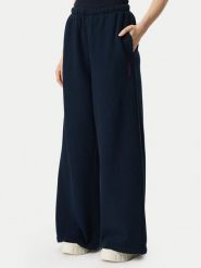 Tommy Jeans Spodnie dresowe Script DW0DW23398 Granatowy Wide Leg. Niebieskie spodnie dresowe damskie Tommy Jeans, bez wzorów, z bawełny. Za 449.99 zł.
