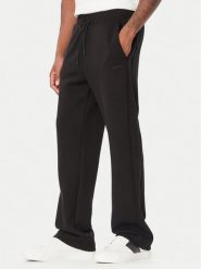 Guess Spodnie dresowe Z6BB04 K6545 Czarny Regular Fit. Czarne spodnie sportowe męskie Guess, m, z aplikacjami, z dresówki. Za 434.99 zł.