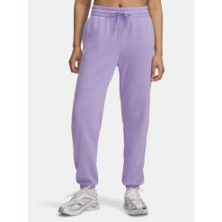 Spodnie dresowe damskie Under Armour Rival Terry Jogger. Fioletowe spodnie dresowe damskie Under Armour, bez wzorów, z dresówki, sportowe, na fitness i siłownię. Za 199.99 zł.