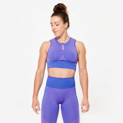 Koszulka fitness damska Domyos crop top bez rękawów. Czerwone topy damskie DOMYOS, m, bez wzorów, z elastanu, sportowe, bez kołnierzyka, bez ramiączek. W wyprzedaży za 69.99 zł.