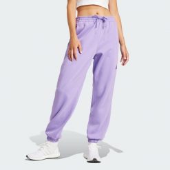 Spodnie Essentials 3-Stripes French Terry Cuffed. Białe spodnie dresowe damskie Adidas, bez wzorów, z materiału, sportowe. Za 219.00 zł.