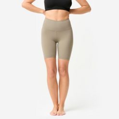 Legginsy krótkie do jogi i pilatesu Domyos. Brązowe legginsy damskie DOMYOS, bez wzorów, z elastanu. Za 69.99 zł.