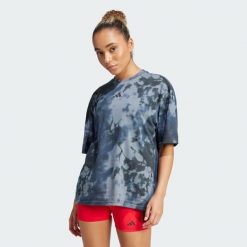 Koszulka Climacool Training Club 24/7 Graphic. Fioletowe bluzki damskie Adidas, s, bez wzorów, sportowe, bez kołnierzyka, bez ramiączek. Za 149.99 zł.