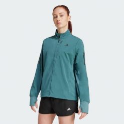 Kurtka do biegania Own the Run Winterized. Niebieskie kurtki sportowe damskie Adidas, m, bez wzorów, bez ramiączek, bez kaptura, do biegania, ClimaWarm (Adidas). Za 439.00 zł.
