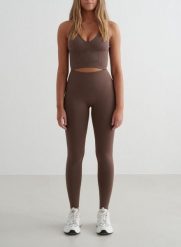 Damskie legginsy bezszwowe, wysoki stan, squat proof petite Shape brąz macchiato. Brązowe legginsy damskie Aim'n, bez wzorów, z elastanu. Za 297.00 zł.
