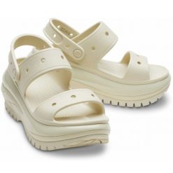 Klapki Crocs Mega Crush Sandal 207989-2Y2 beżowy. Brązowe klapki damskie na lato, bez wzorów, casualowe, bez obcasa, na platformie, bez zapięcia. Za 449.26 zł.