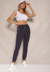 Granatowe Spodnie Dresowe z Bawełny o Kroju Jogger High Waist Cherisa. Niebieskie spodnie dresowe damskie Renee, bez wzorów, z bawełny, eleganckie, z podwyższonym stanem. Za 49.99 zł.