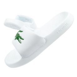 Klapki Lacoste Serve Slide W 02082 białe. Białe klapki damskie bez wzorów, z syntetyku, sportowe, bez obcasa, bez zapięcia. Za 347.21 zł.