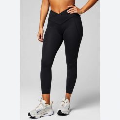Legginsy 7/8 wysoki stan krzyżowane damskie Fabletics Oasis. Czarne legginsy damskie FABLETICS, bez wzorów, z materiału. Za 361.35 zł.