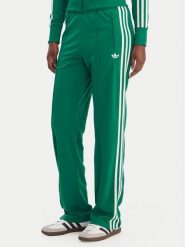 Adidas Spodnie dresowe Firebird Classic KD3649 Zielony Regular Fit. Zielone spodnie dresowe damskie Adidas, bez wzorów, z dresówki. Za 299.99 zł.