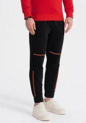 Ombre Spodnie męskie dresowe z kontrastowymi przeszyciami - czarne V1 OM-PASK-0145 L. Czarne spodnie sportowe męskie Ombre, l, bez wzorów, z dresówki. Za 59.99 zł.
