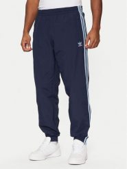 Adidas Spodnie dresowe adicolor Firebird JP1249 Granatowy Regular Fit. Niebieskie spodnie sportowe męskie Adidas, m, bez wzorów, z dresówki. Za 209.99 zł.
