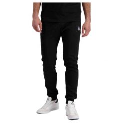 Wąskie spodnie do biegania Le Coq Sportif Pantalon de jogging ample Le Coq Sport. Czarne spodnie sportowe męskie le coq sportif, bez wzorów, do biegania. Za 318.60 zł.