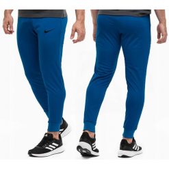 Nike spodnie męskie dresowe sportowe treningowe wygodne dresy logo. Niebieskie spodnie sportowe męskie Nike, m, bez wzorów, z dresówki, dri-fit (nike). Za 219.99 zł.