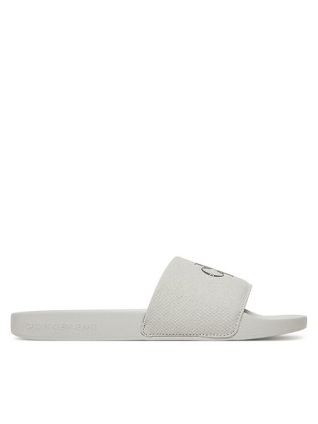 Calvin Klein Jeans Klapki Slide Monogram Cv YM0YM01271 Szary. Szare klapki męskie Calvin Klein Jeans, bez wzorów, z jeansu, bez zapięcia. Za 99.99 zł.