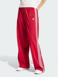 Adidas Spodnie dresowe Firebird Loose Tracksuit KS4670 Czerwony Loose Fit. Czerwone spodnie dresowe damskie Adidas, bez wzorów, z dresówki. Za 298.99 zł.
