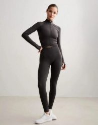 Damskie legginsy dłuższe, wysoki stan, invisible scrunch Shape Seamless szare. Szare legginsy damskie Aim'n, bez wzorów, z dzianiny. Za 301.00 zł.
