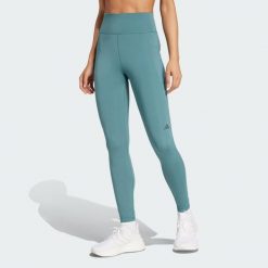 Legginsy Own the Run 7/8. Niebieskie legginsy damskie Adidas, bez wzorów, z materiału. W wyprzedaży za 217.62 zł.